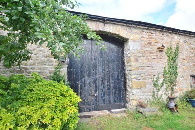 The detached barn to the rear has been used as a silver jewellery workshop.
