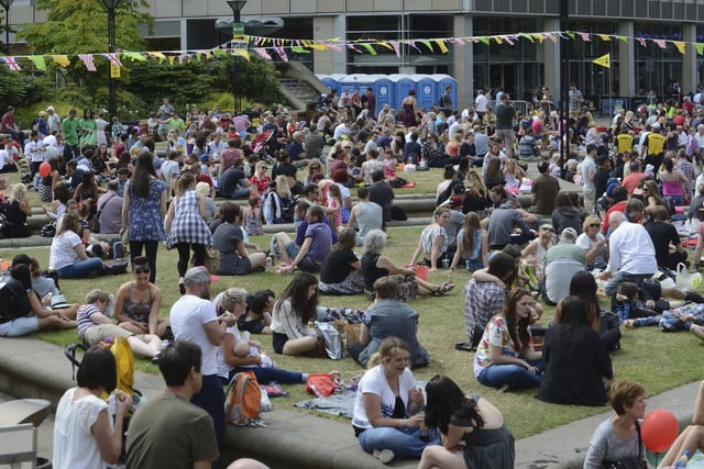 Fans listen to the bands playing the Peace Gardens during  Tramlines 2014