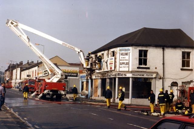 Firefighters at Hallam Sports, junction of Infirmary Road and Bedford Street in 1991. Photo: Picture Sheffield