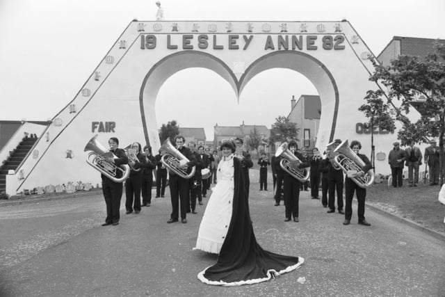 A local brass band follows Bo'ness Fair Queen Lesley Anne Culbert through the traditional arch to be crowned at Glebe Park.