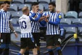 Sheffield Wednesday's Sylla Sow is mobbed by his team mates after his goal against Plymouth Argyle. Pic Steve Ellis