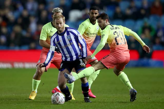 Barry Bannan of Sheffield Wednesday battles for possession with Bernardo Silva of Manchester City during the FA Cup Fifth Round tie at Hillsborough tonight. (Photo by Clive Brunskill/Getty Images)