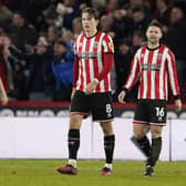 Sander Berge and Oliver Norwood of Sheffield United look dejected after Cameron Archer of Middlesbrough scores to make it 2-1 during the Sky Bet Championship match at Bramall Lane: Andrew Yates / Sportimage