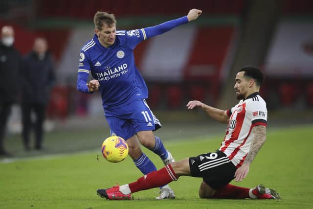 Leicester's Marc Albrighton is tackled by Sheffield United's Kean Bryan (Nick Potts, Pool via AP)