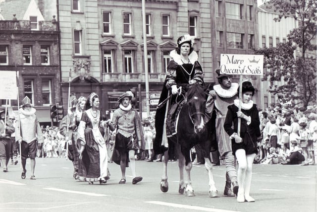 Making a stately horseback journey through the centre of town is a 'captured' Mary, Queen of Scots during the Sheffield Historical Pageant in July 1976