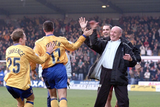 Mansfield Town celebrate a 4-0 FA Cup giantkilling of Huddersfield that earned them a third round trip to Leicester City.