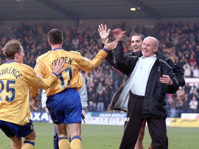 Mansfield Town celebrate a 4-0 FA Cup giantkilling of Huddersfield that earned them a third round trip to Leicester City.