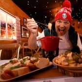 Many restaurants need a Christmas chef. Chef Andrew Pern pictured trying the Fondue in The Winter Hütte at York Christmas Market. Picture by Simon Hulme 22nd November 2022