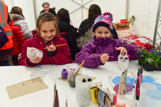 Maggie Wheetman (8) and Isabel Clark (7) in the craft tent at the festival 2 years ago.