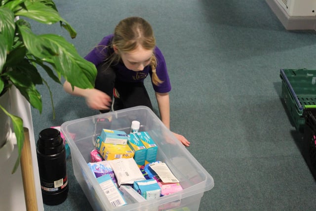 Children packing donations for charity