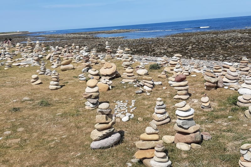There are hundreds of stone-stacks on the shoreline beyond the castle.