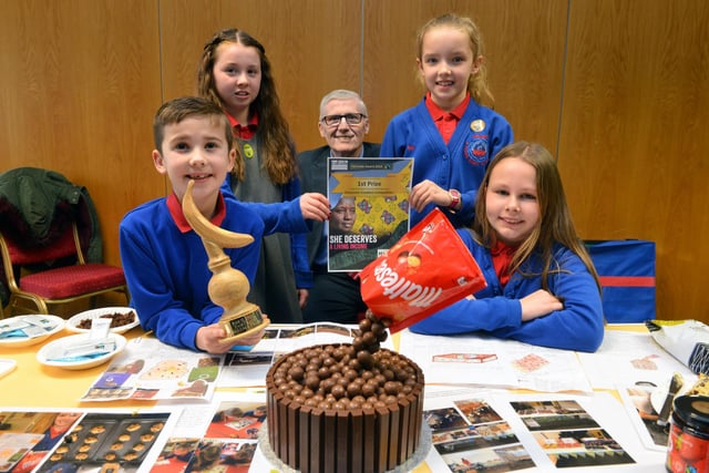 Plenty of reason to smile at Throston Primary School which won a Fairtrade Fortnight chocolate competition two years ago. In the picture, from left, were Oliver Harrison, 8, Annalise Frater, 10, Neve Watson, 9 and Sadie Jukes, 10 with deputy Mayor Rob Cooke.