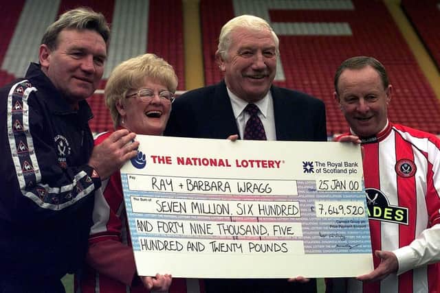 Sheffield United fans Ray and Barbara Wragg celebrate winning Saturday's £7,649,520 National Lottery jackpot with their team's chairman Derek Dooley and ex mid-fielder Tony Currie (far left) at Sheffield's Bramall Lane football ground, Tuesday 25 January 2000. Watch for PA story. PA photo: Rui Vieira.