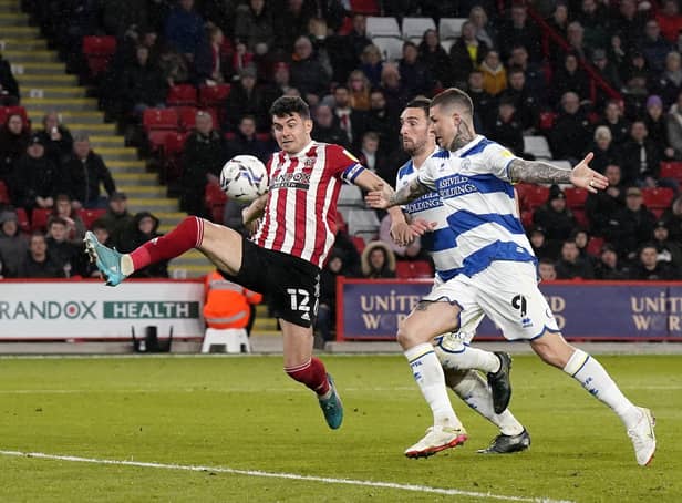 John Egan of Sheffield Utd with Lyndon Dykes of QPR during the Sky Bet Championship match at Bramall Lane. Picture:  Andrew Yates / Sportimage
