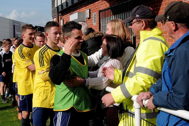 Worksop Town players share a moment with the fans as another season comes to an end.