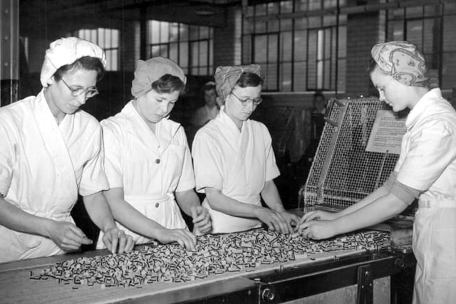 Staff are pictured checking Liquorice Allsorts in 1952.