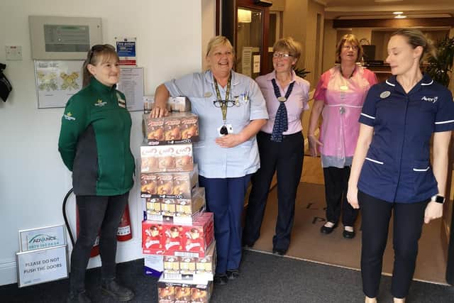 Denise delivering donations and 'food bank basics' bags from Morrisons Hillsborough