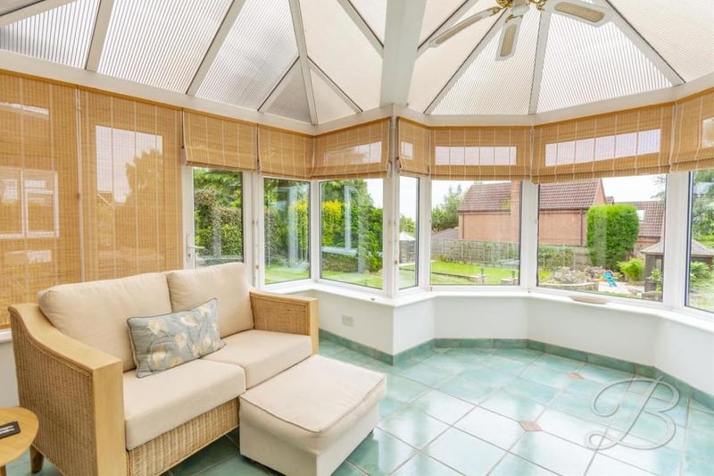 The conservatory adds a touch of class to the property. It has the added benefit of surrounding windows that offer a pleasant view of the garden all year round,.