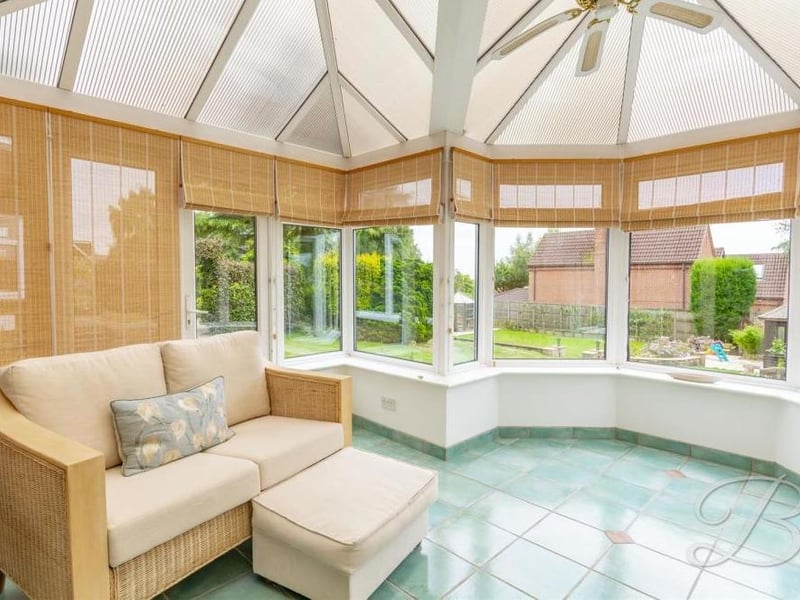 The conservatory adds a touch of class to the property. It has the added benefit of surrounding windows that offer a pleasant view of the garden all year round,.