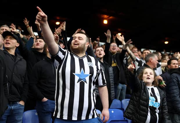 LONDON, ENGLAND - OCTOBER 23:  Newcastle Fans show their support during the Premier League match between Crystal Palace and Newcastle United at Selhurst Park on October 23, 2021 in London, England. (Photo by Julian Finney/Getty Images)