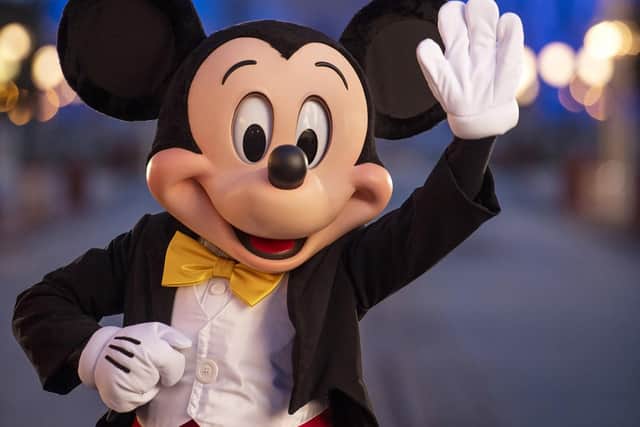 LAKE BUENA VISTA, FL - JULY 11:  In this handout photo provided by Walt Disney World Resort, Mickey Mouse pauses on Main Street, U.S.A. just before sunrise at Walt Disney World Resort on July 11, 2020 in Lake Buena Vista, Florida. (Photo by Kent Phillips/Walt Disney World Resort via Getty Images)