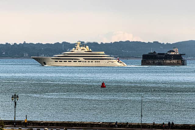 The Dilbar super yacht passes one of the Solent Fort as she makes her journey through the Solent from Southampton.