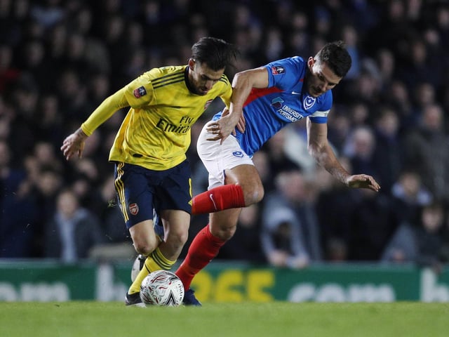 Portsmouth's Gareth Evans competes for the ball.