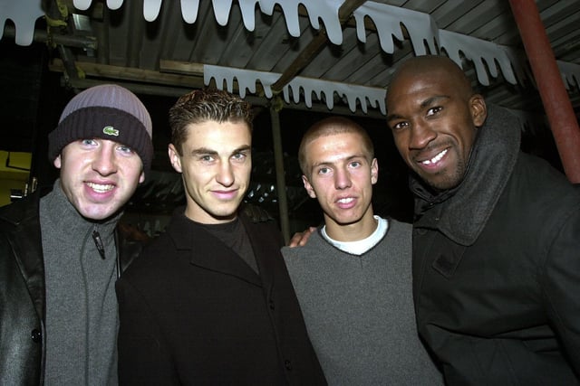Pompey football heroes (left to right), Shaun Derry, Mike Panopoulos, Gary O'Neil and Darren Moore enjoy the Christmas lights switch on at Commercial Road in Portsmouth.
