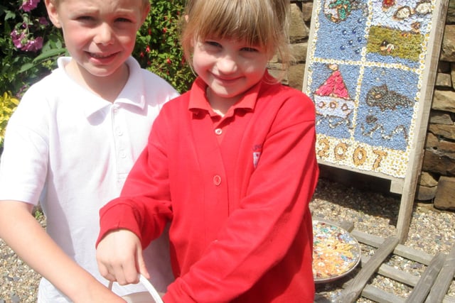 Nathan Mather and Millie Wykes at  St Marys Primary school for Unstone well dressing in 2007
