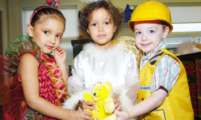 Children at Warren Day Nursery in 2007. They are all dressed up to raise money for charity.
