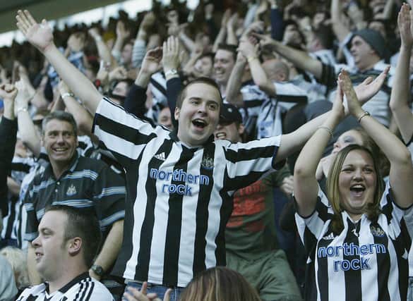 Newcastle United fans celebrate their first goal during the FA Barclaycard Premiership match between Southampton and Newcastle United at St. Mary's Stadium.