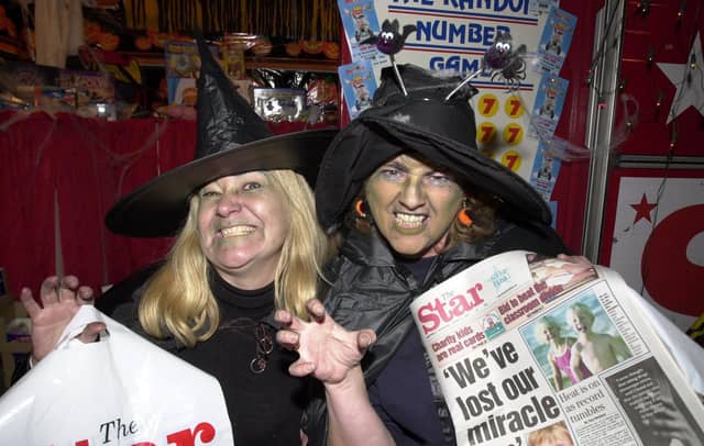 Seen are two witches running the Star stand at the Fright Night held in the Sheffield city centre for Halloween, October 31, 2001