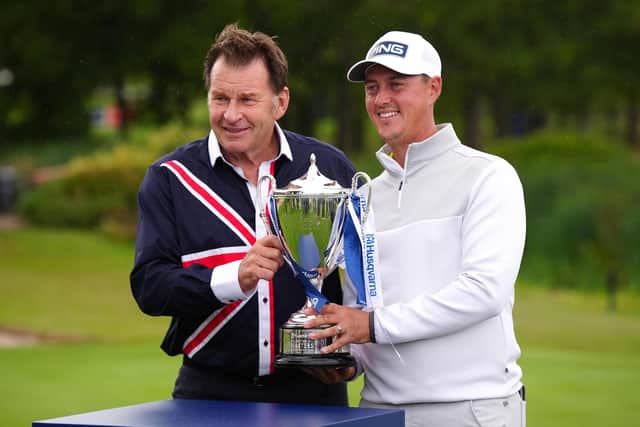 Winner Joe Dean of England (right) receives the trophy from Sir Nick Faldo after day four of the Husqvarna British Masters at The Belfry Hotel & Resort (Picture: PA)