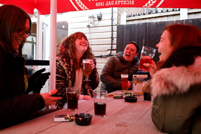 Beer gardens were bustling with customers on Monday as people braced the cold weather to return to pubs across England.