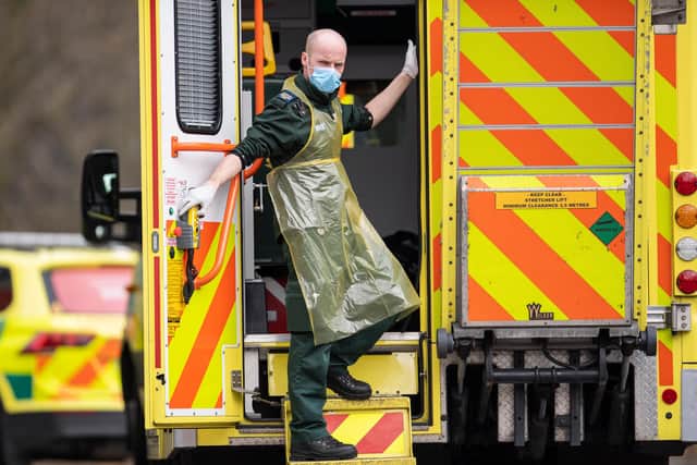 A London Ambulance Service worker is seen in the back of an ambulance (Photo by Justin Setterfield/Getty Images)