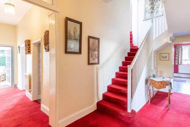 This impressive hallway provides the perfect welcome to the ten-bedroom, detached property. It leads to four reception rooms in the main section of the ground floor.