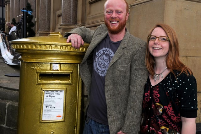 Newlyweds Lizzie and Steve Roche pictured on August 6, 2012 at the gold postbox painted in honour of their friend Jess Ennis's gold medal