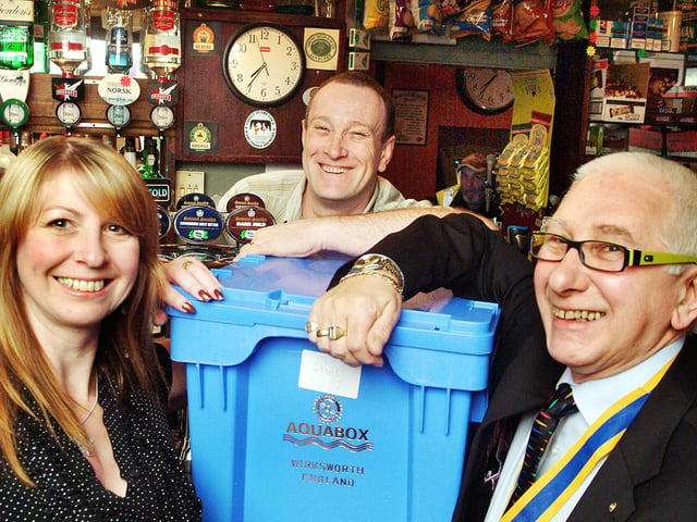 08-0084-2.

Landlord and landlady of the Rose and Crown, Stoneyford Road, Sutton,Steve and Nikki Smith, hand over an aquabox to Kirkby Rotary Club President Bill Wilson at their Sutton pub in 2008