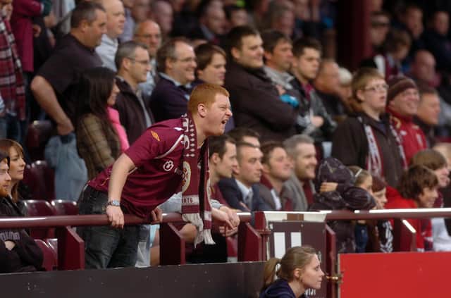 A Hearts fan urges his team on