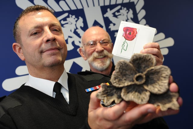 Durham Community Fire Station watch manager Michael Burdon and sculptor Allan Scott with a very special poppy in 2015. Who can tell us more?
