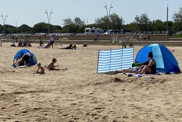 Many families settled down for a day in the sunshine at the beach.