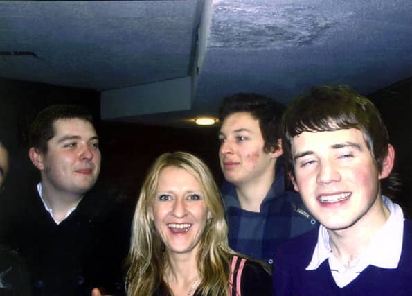 Jaqui Dowling with Arctic Monkeys Andy Nicholson, Matt Helders and Jamie Cook.