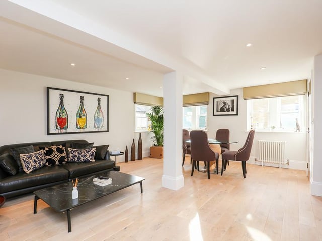 The ground floor living space includes a dining area.