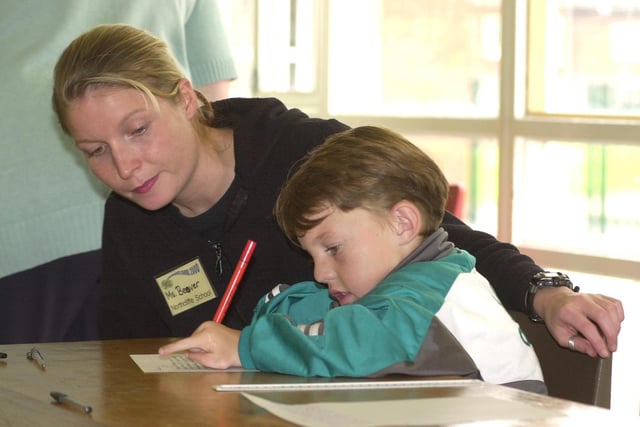 Teacher Cathryn Beever helps Summer School pupil Ben Cresswell, aged 11, of Conisbrough back in 2000