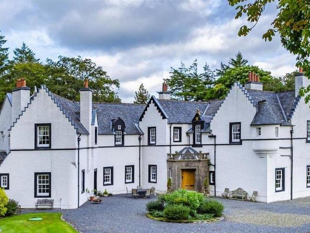 Sitting on the outskirts of Strathaven in South Lanarkshire, Stobieside House offers Baronial grandeur with beautiful views ober Loudoun Hill and the surrounding countryside. Built in around 1869, the house includes an impressive seven bedrooms, reception hall, a barrel vaulted games room, drawing room, formal dining room, family room, modern luxury fitted kitchen open plan to a living/dining area, home office, arts and crafts studio, gym, utility room, dressing room, five bathrooms/en-suites, and four cloakrooms/WCs.
There's also a large private and enclosed garden, a large garage with workshop and a shed - all for offers over £1.2 million.