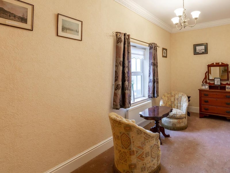 With carpet to flooring, two central heating radiators, cupboard for additional storage, window to the front elevation.