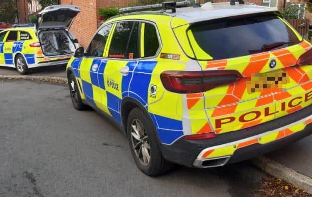 File picture shows police cars. Police have made 10 arrests in an operation aimed against organised gangs in Sheffield