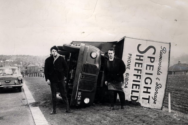 Two men escaped from their overturned lorry at Whiston, Rotherham, when a hurricane hit the area on February 16, 1962