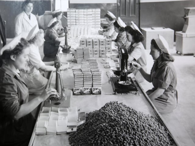 The confectioner Simpkins celebrated its centenary in 2021 and still operates from the same factory in Hillsborough, pictured here.
Simpkins has been making its famous boiled sweets since being founded in 1921 by Albert Leslie Simpkin on his return from the First World War. The firm still uses the same techniques and some of the same machinery to churn out some five million sweets a week.
The travel tins, which are a classic childhood memory of long car journeys, were introduced to prevent the sweets going sticky due to their high fruit juice content, with the white powder initially added to stop the sweets sticking together.
The original tins of Simpkins sweets all contained Barley Sugar Drops, which according to the firm are proven to alleviate the symptoms of travel sickness, which is why they became called travel sweets.
Simpkins is today run by Albert's grandchildren Adrian and Karen Simpkin.