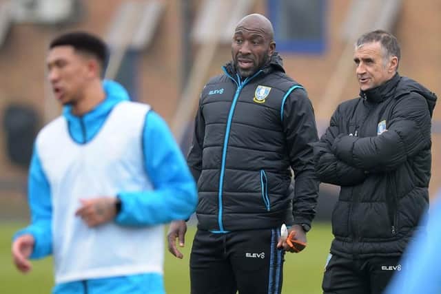 Darren Moore last month with Liam Palmer in the foreground at Sheffield Wednesday's training ground. (via swfc.co.uk)